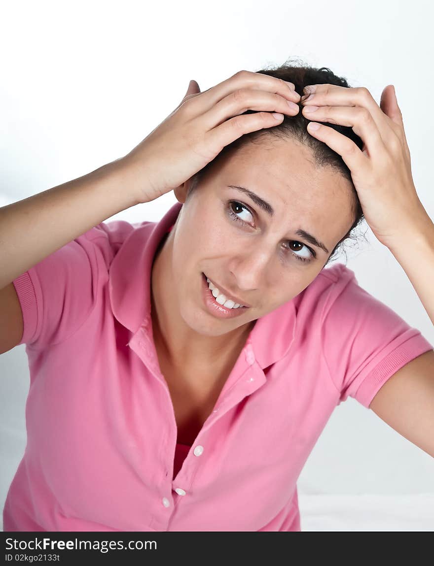 Concerned woman, checking her hair. Concerned woman, checking her hair