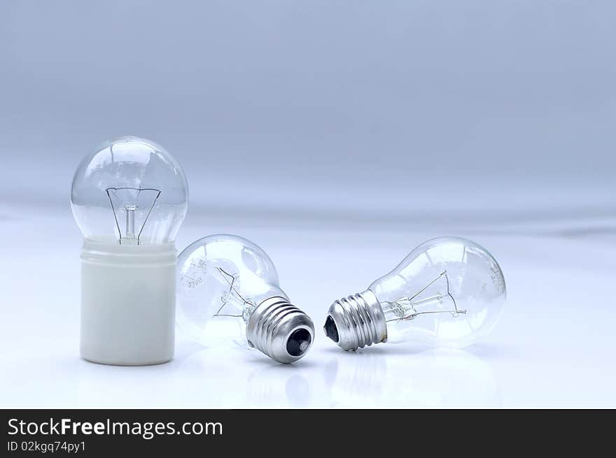 Several electric lamps on light background