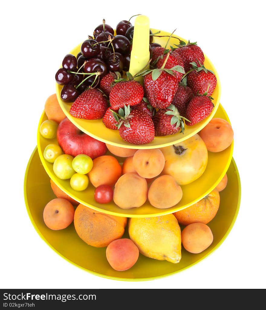 Fruits in green vase iisolated on white background