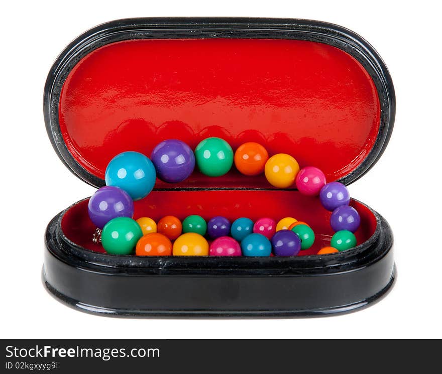 Blackenning wooden small box with red internal part with necklace on white background