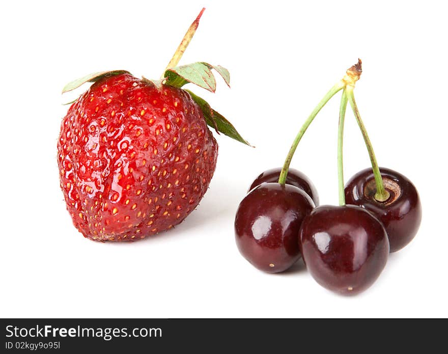 Strawberries and sweet cherries on white background