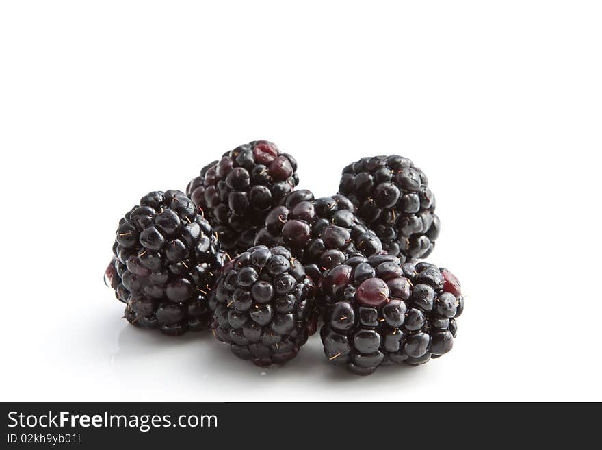 A group of blackberries with water droplets