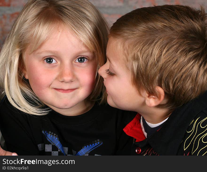 Beautiful young girl with blond hair and her cute boy friend. Beautiful young girl with blond hair and her cute boy friend