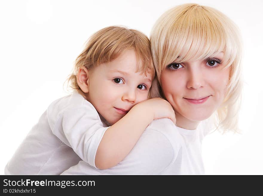 Portrait of little boy embracing woman. Isolated on the white. Portrait of little boy embracing woman. Isolated on the white.