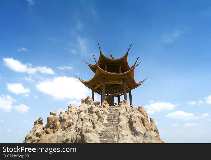 Pavilion in chinese garden under blue sky