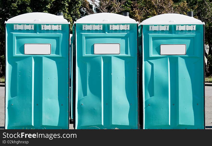 Port-a-potties in a row outdoors