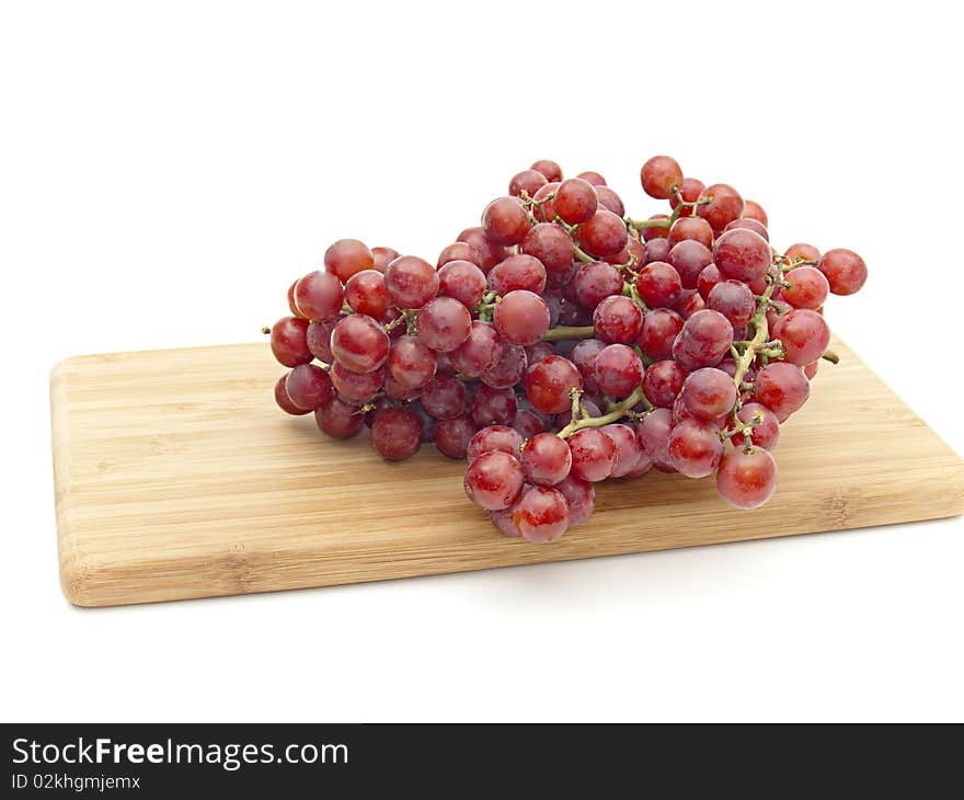 Bunch red grapes on board