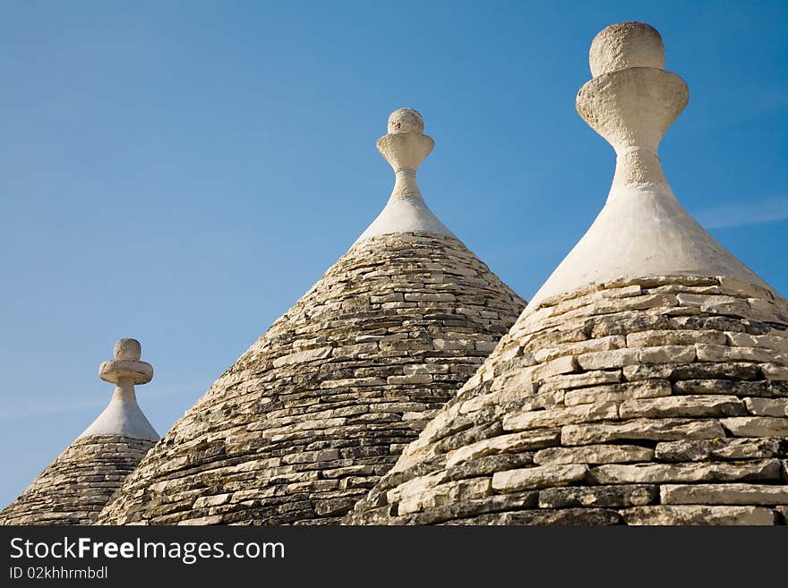 Trulli house in Italy, specific conical roofed houses in Apulia. Unesco World Heritage site famous as a top travel destination in Apulia. Trulli house in Italy, specific conical roofed houses in Apulia. Unesco World Heritage site famous as a top travel destination in Apulia