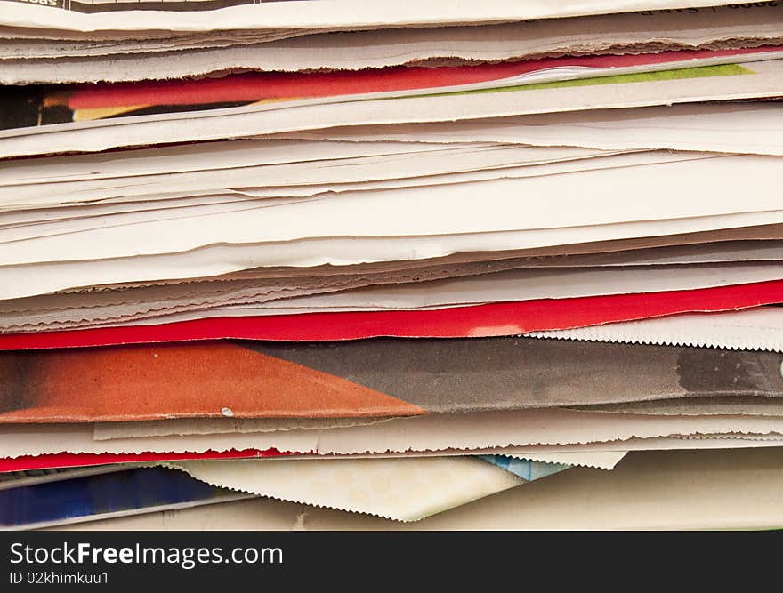 Close-up of newspaper and cardboard flattened for recycling. Close-up of newspaper and cardboard flattened for recycling