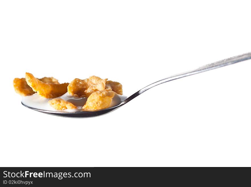 Corn flakes on spoon