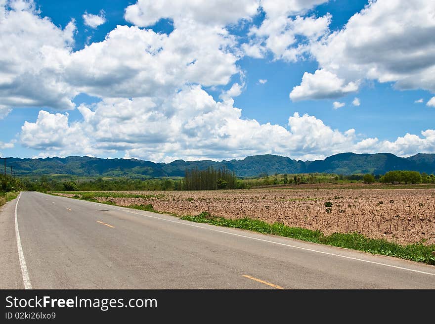 Countryside road forward to mountains. Countryside road forward to mountains