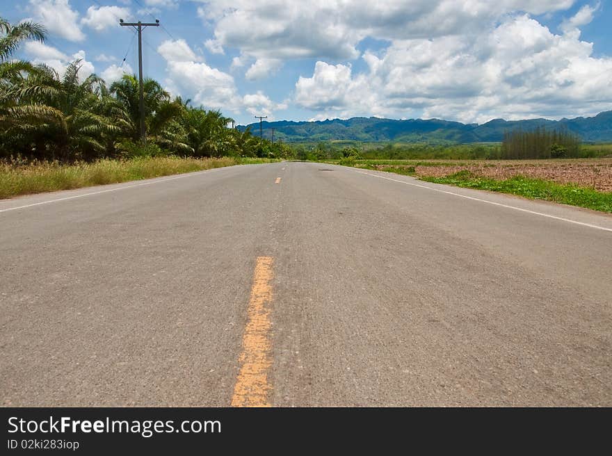 Countryside road forward to mountains. Countryside road forward to mountains