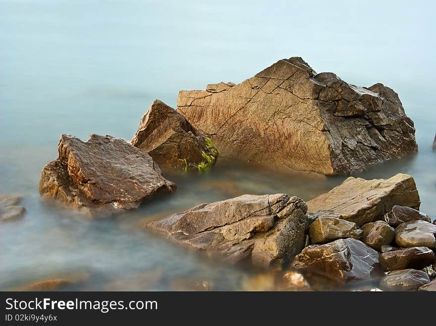 Stones in a quiet sea. Stones in a quiet sea