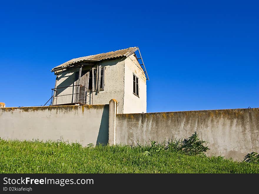 Alone house on a blue sky background