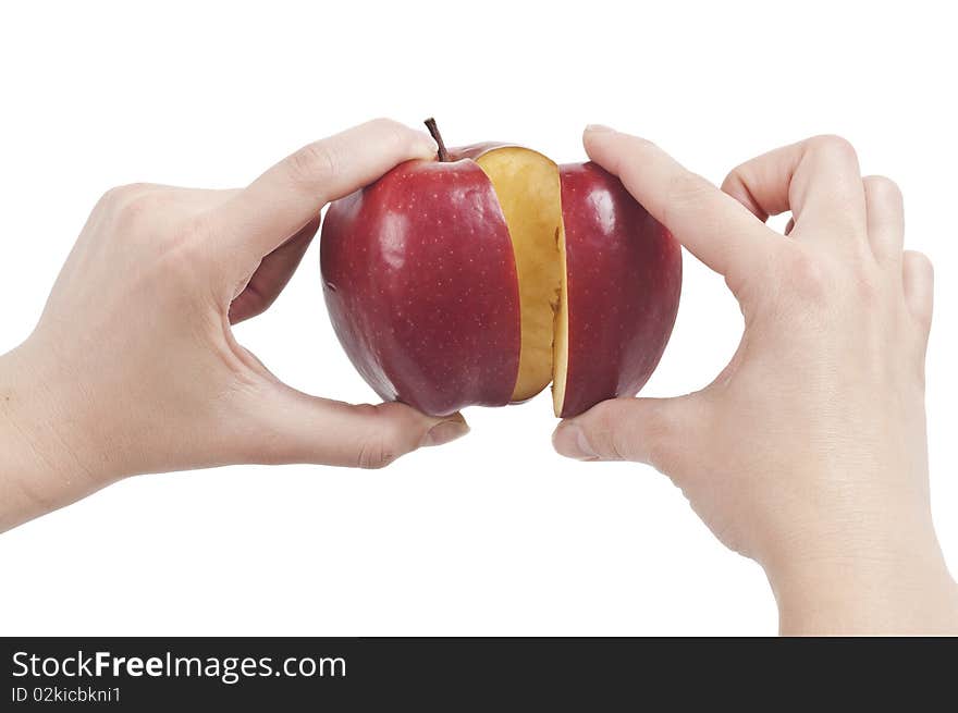 Hands holding a red sliced Apple (with clipping path). Hands holding a red sliced Apple (with clipping path)