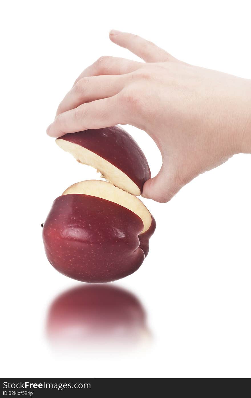 Hand taking a slice of red Apple (clipping path included). Hand taking a slice of red Apple (clipping path included)