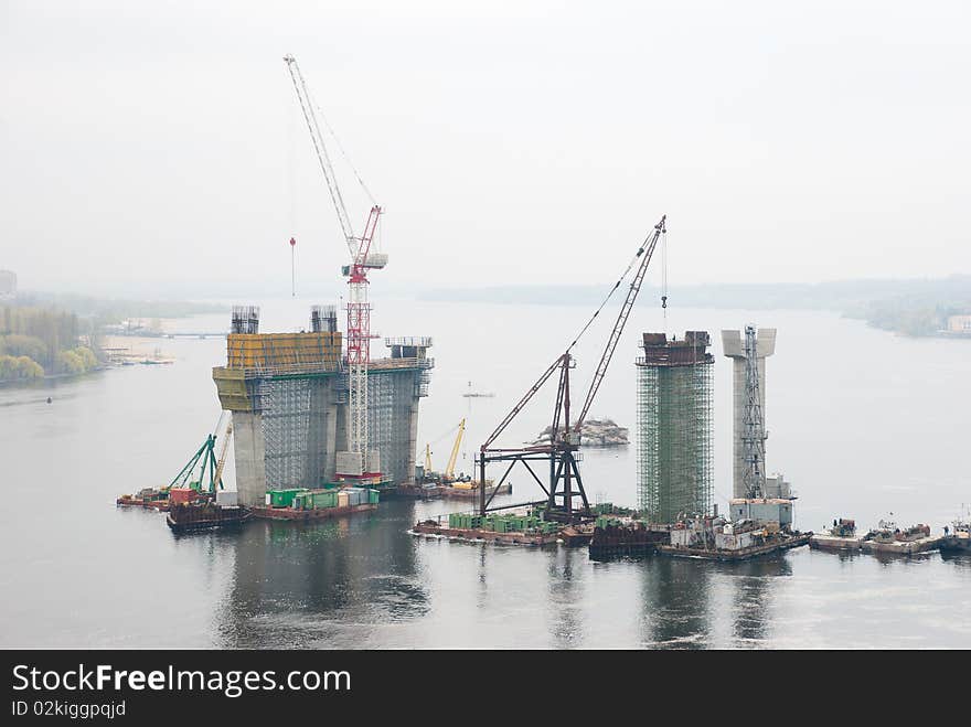 Construction of a bridge over the river. Construction of a bridge over the river