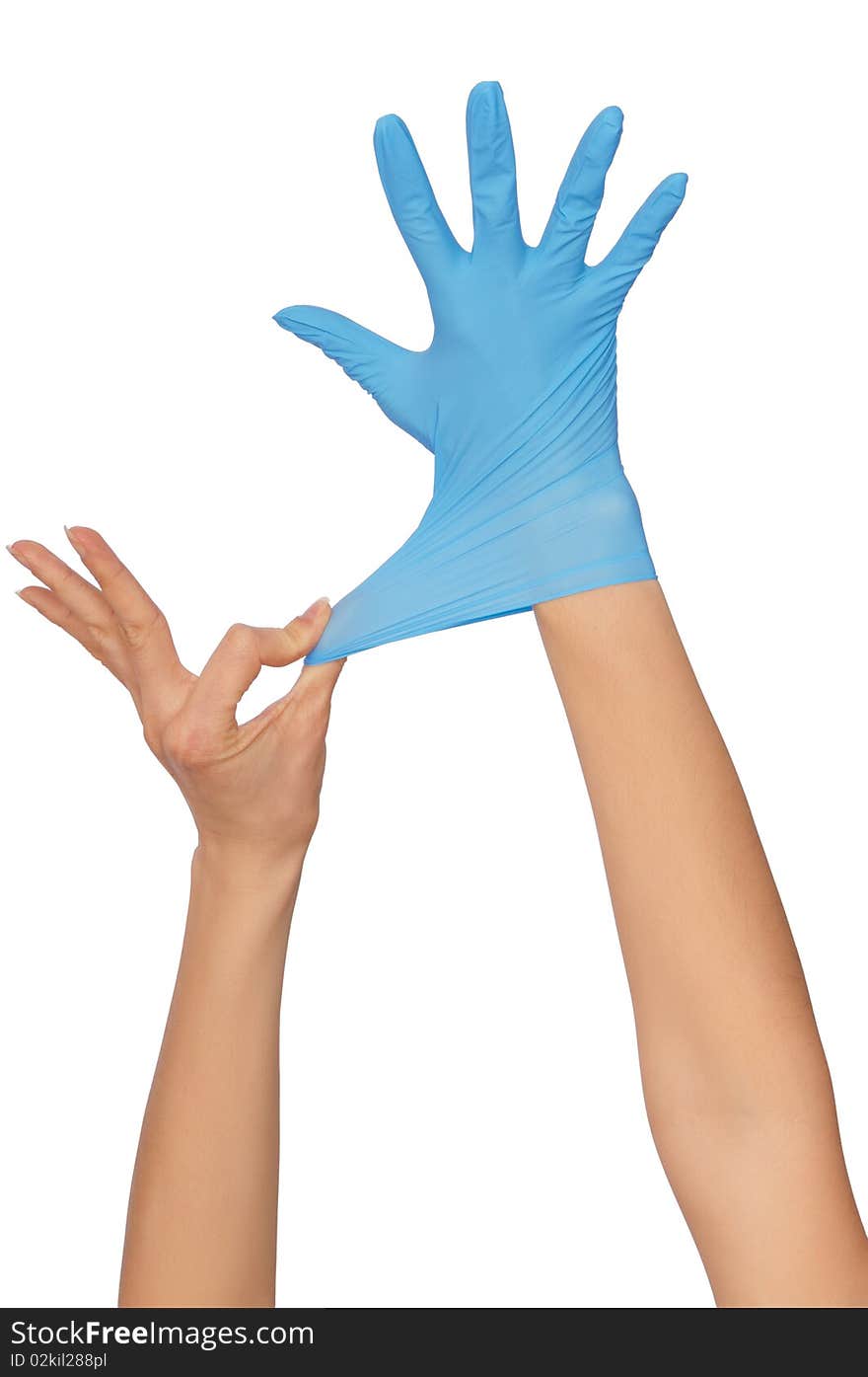 Doctor putting on blue sterilised medical glove for making operation