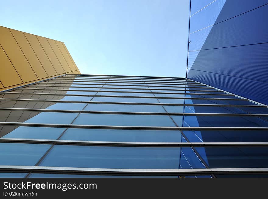 A Modern Commercial Building with blue sky background. A Modern Commercial Building with blue sky background