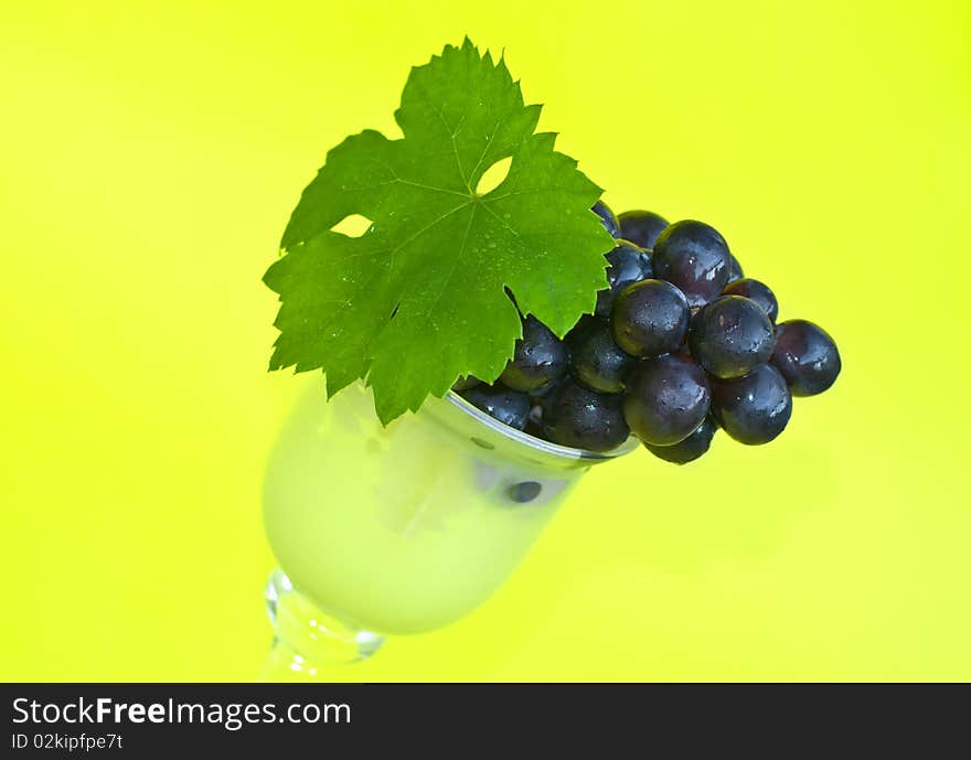 Grape on yellow background, close up