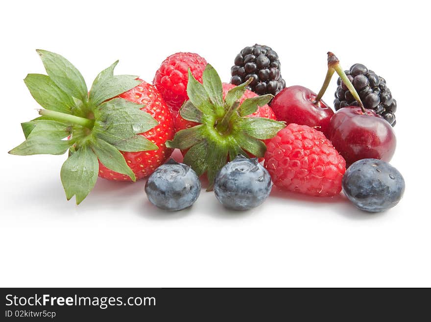 A selection of summer berries isolated in the studio. A selection of summer berries isolated in the studio