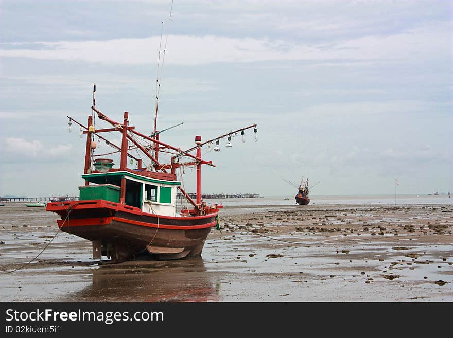 Fishing boat stuck on shore