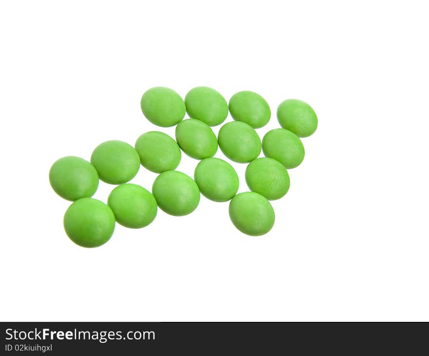 Green tablets in arrow formation, isolated on white background