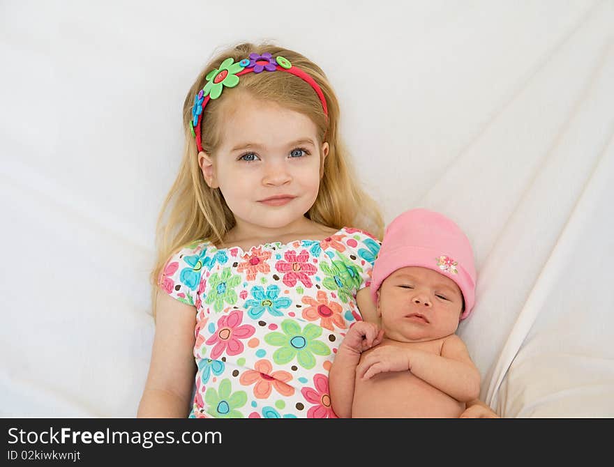 Big Sister Holding Her New Sister. Big Sister Holding Her New Sister