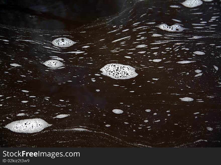 Blanching spume on surfaces water