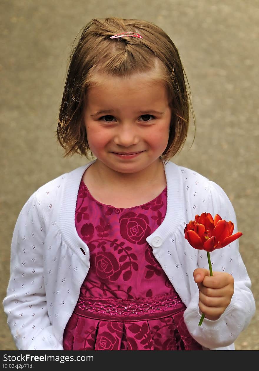 Sweet smiling girl with garden tulip. Sweet smiling girl with garden tulip