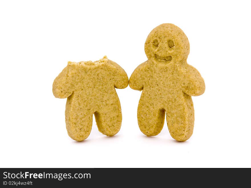 Two Gingerbread Men One With Head Bitten Off