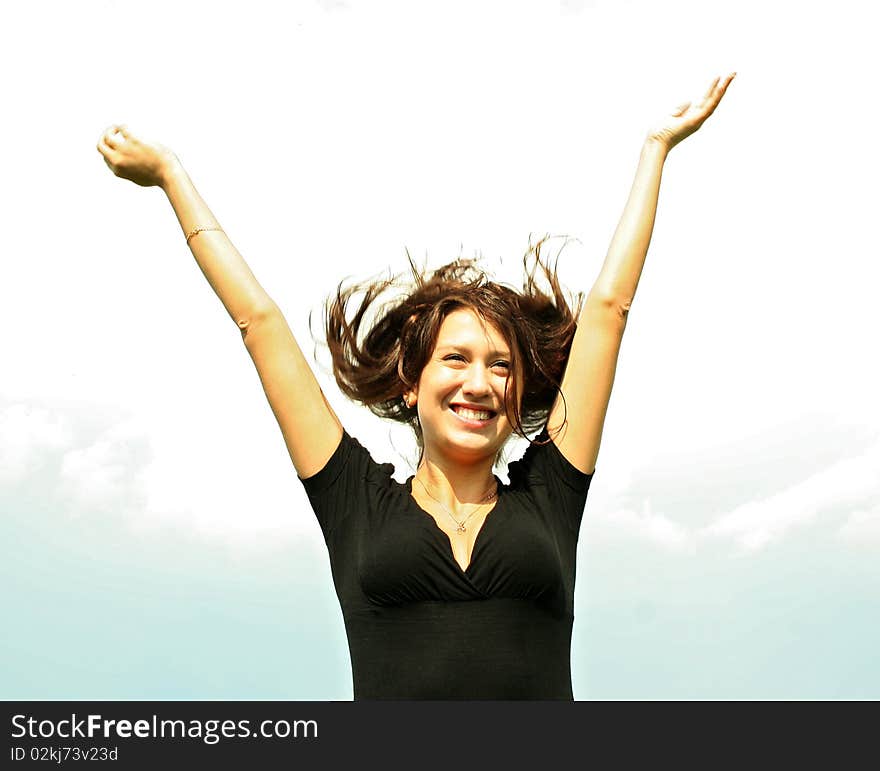 Young Beautiful Brunette Girl Keeps Hands Up Outdo