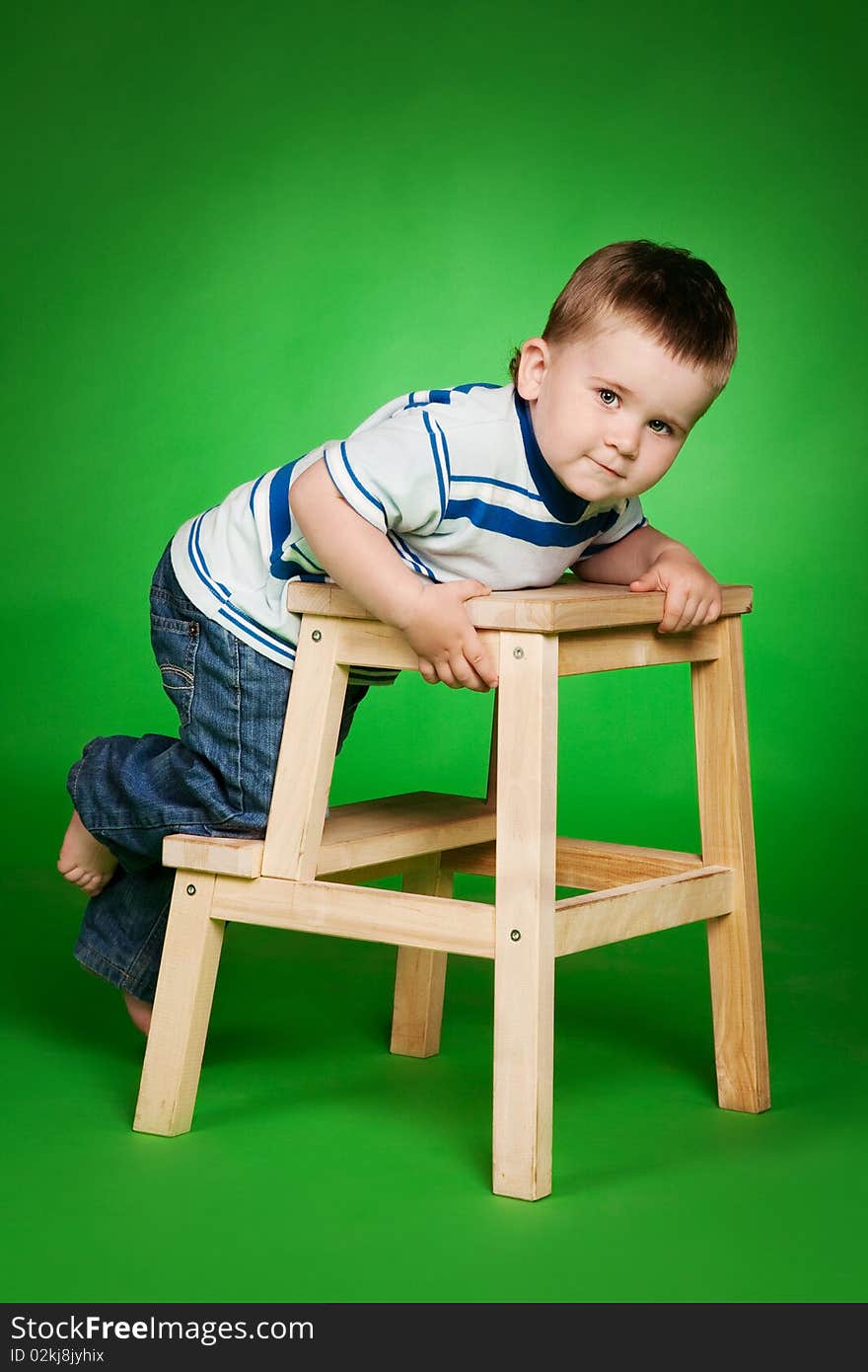 Little boy on stairs in studio