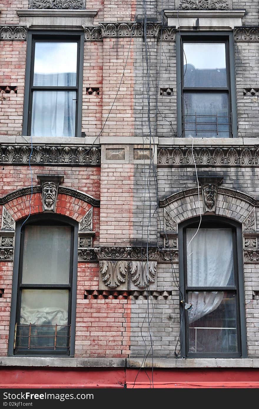 Tenement  buildings painted different colors, red and black. Tenement  buildings painted different colors, red and black.