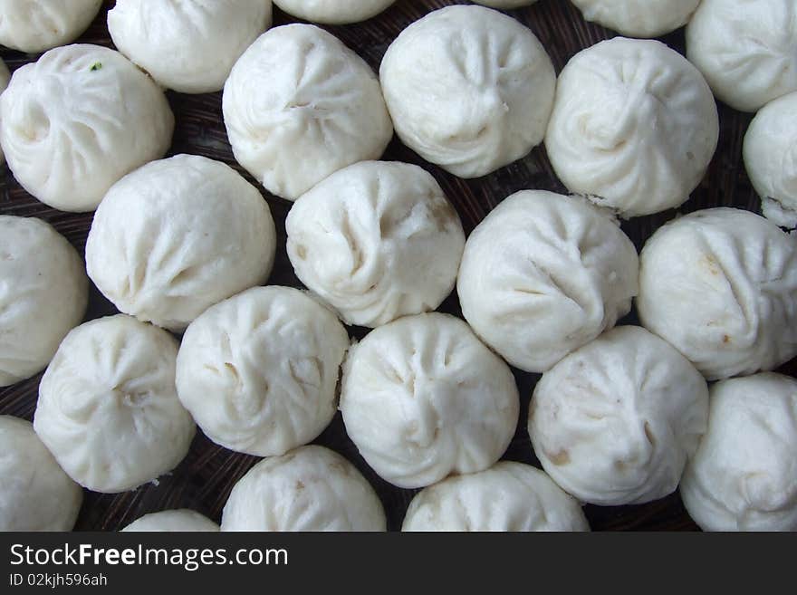 Traditonal chinese steamed bun stuffed with savory meat. Traditonal chinese steamed bun stuffed with savory meat