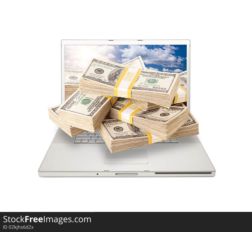 Silver Computer Laptop Isolated on White with Stacks of Hundred Dollar Bills Extruding the Screen. Silver Computer Laptop Isolated on White with Stacks of Hundred Dollar Bills Extruding the Screen.