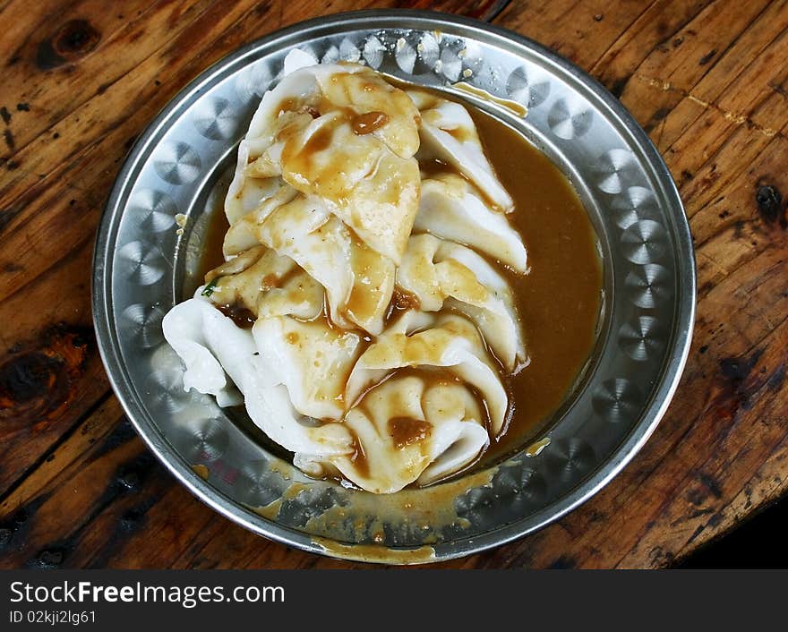 The dumpling in china,on dish with gravy...