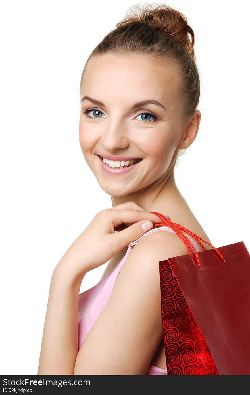 Cheerful young woman holding red shopping bag. Cheerful young woman holding red shopping bag