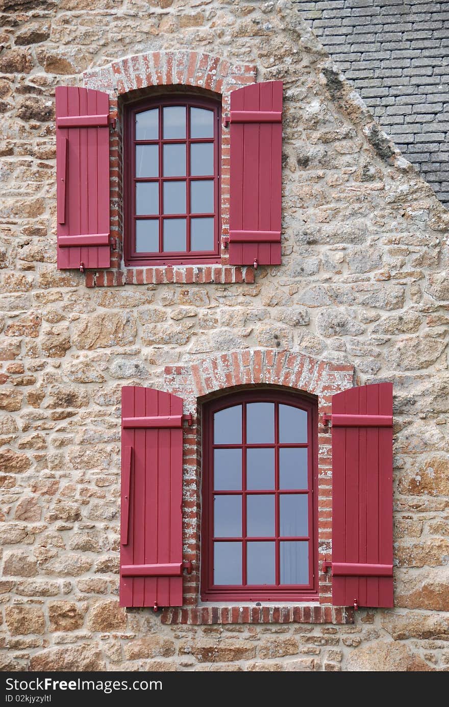 Red windows with shutter in britany france