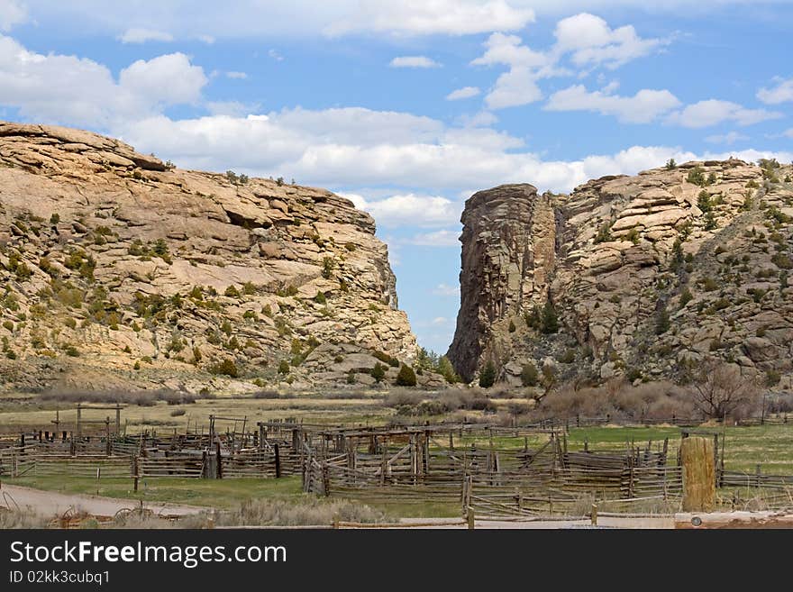 A landmark to the pioneers moving west in their wagons with a ranch in the foreground. A landmark to the pioneers moving west in their wagons with a ranch in the foreground