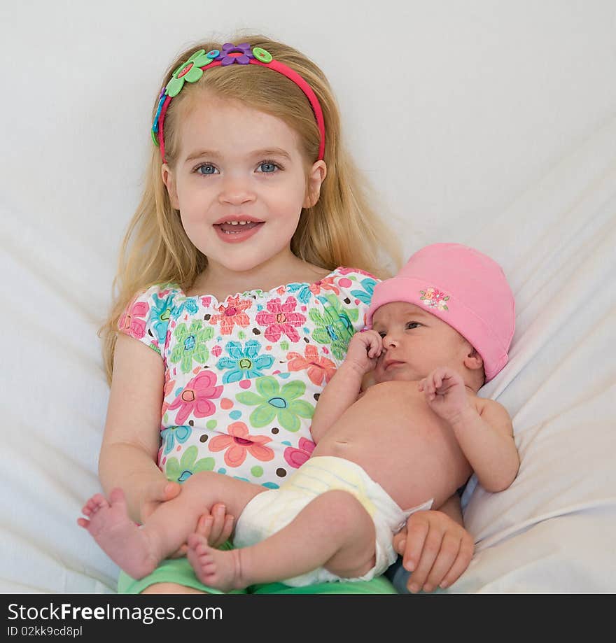 Big Sister Holding Her New Sister. Big Sister Holding Her New Sister