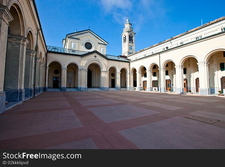 The courtyard of the shrine.
On September 22, 1985 the shrine was visited by Pope John Paul II. On May 18, 2008 the shrine was visited by Pope Benedict XVI.
The “Shrine of Nostra Signora della Guardia” is a Catholic place of pilgrimage and is located on the top of Mount Figogna
The name “Guardia” in Italian means “watch” and the shrine is so called because the Mount Figogna, in the Middle Ages was a strategic observation post.