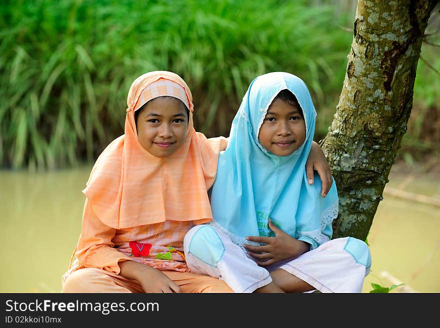 Outdoor portrait of happy Muslim girls. Outdoor portrait of happy Muslim girls