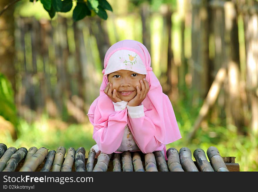 Outdoor portrait  of Indonesian happy Muslim girl