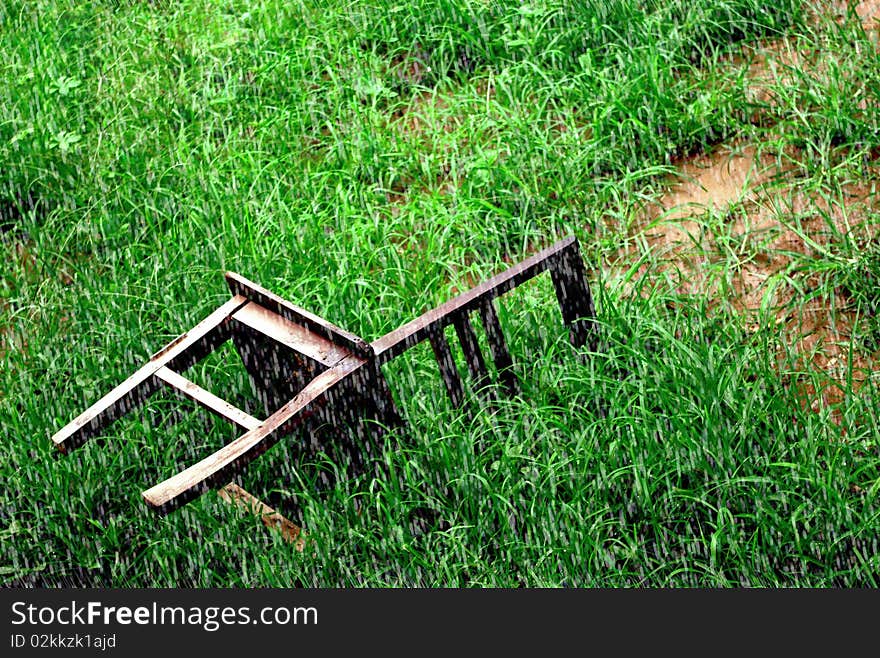 Chair on the ground in rainy day.