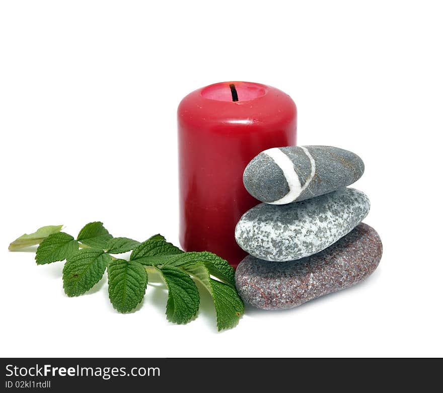 Picture of conflagrant candle and stone on a white background