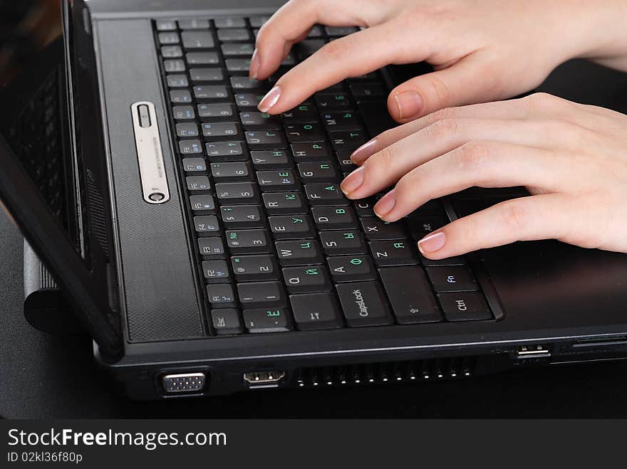 Hands working on laptop