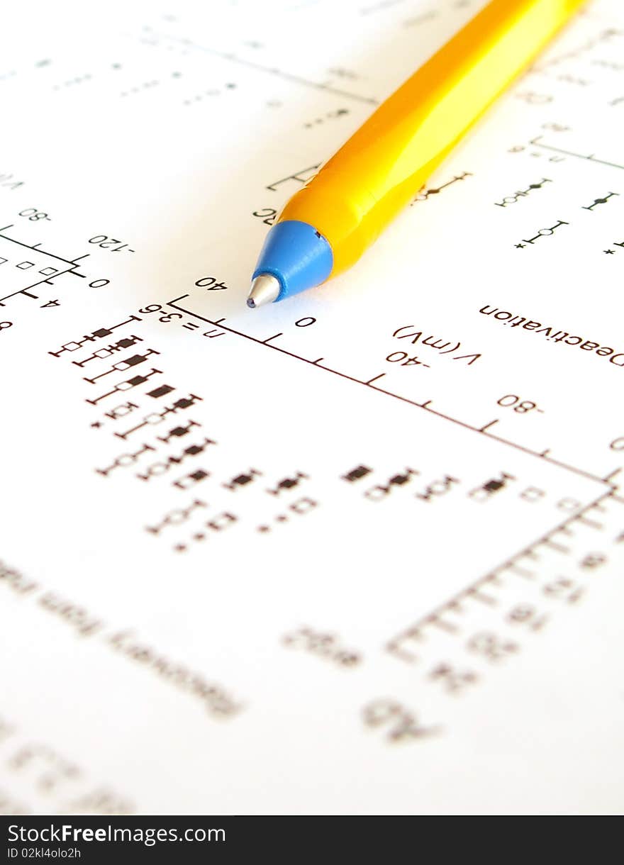 Mathematical graph and pen on a piece of paper. Mathematical graph and pen on a piece of paper