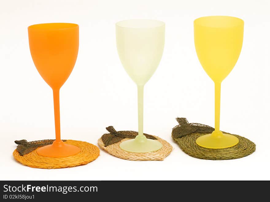 Three glasses colored by cocktail