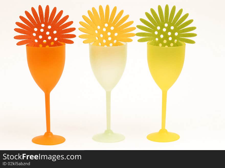 Three glasses colored by cocktail